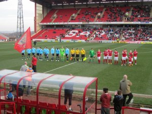 The players line up prior to kick off
