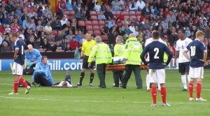 An England player has to be stretchered off in the first half